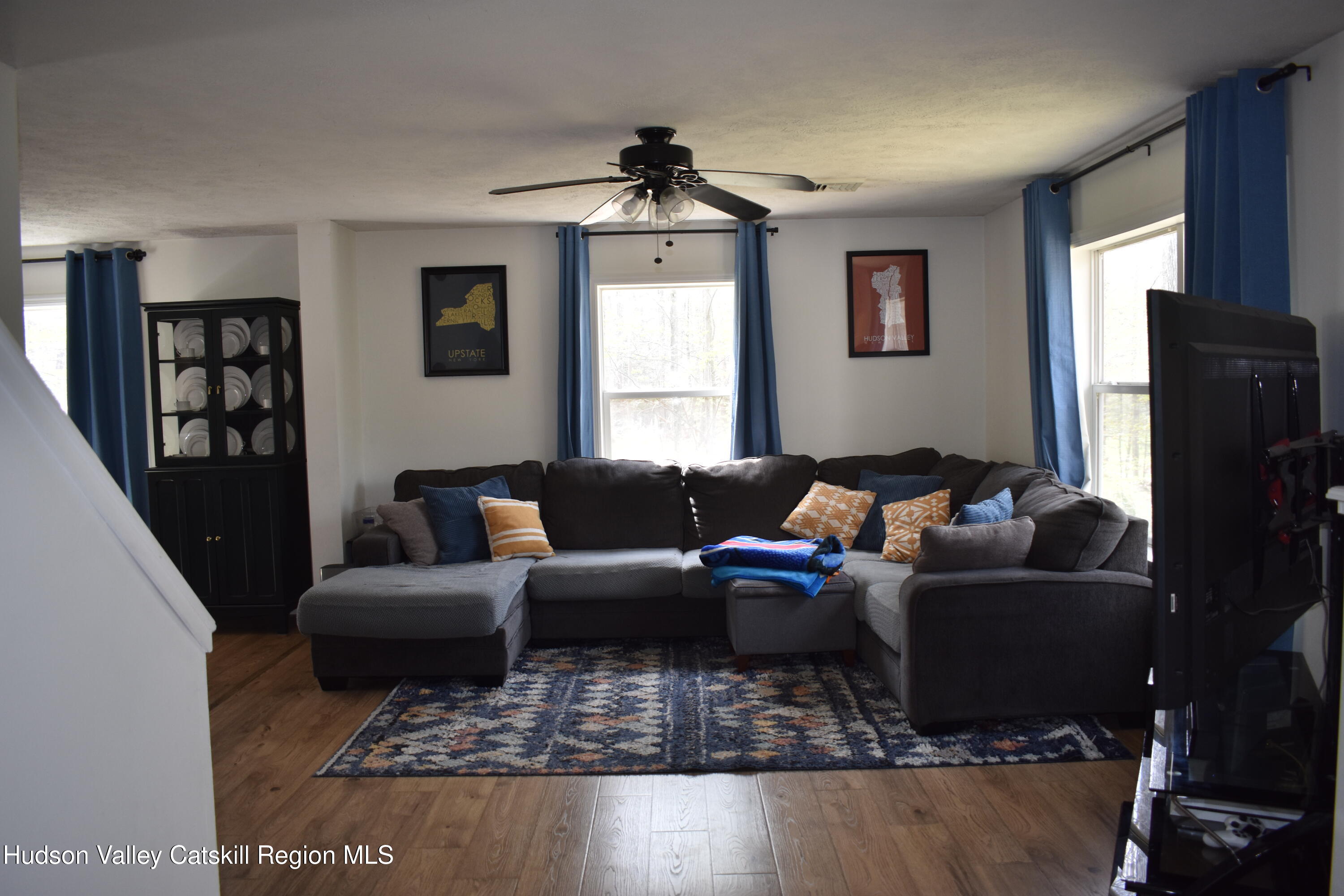 125 Hardenburgh Road Ulster Park, NY 12487 - Photo 8 of 45 a living room with furniture a rug and a window