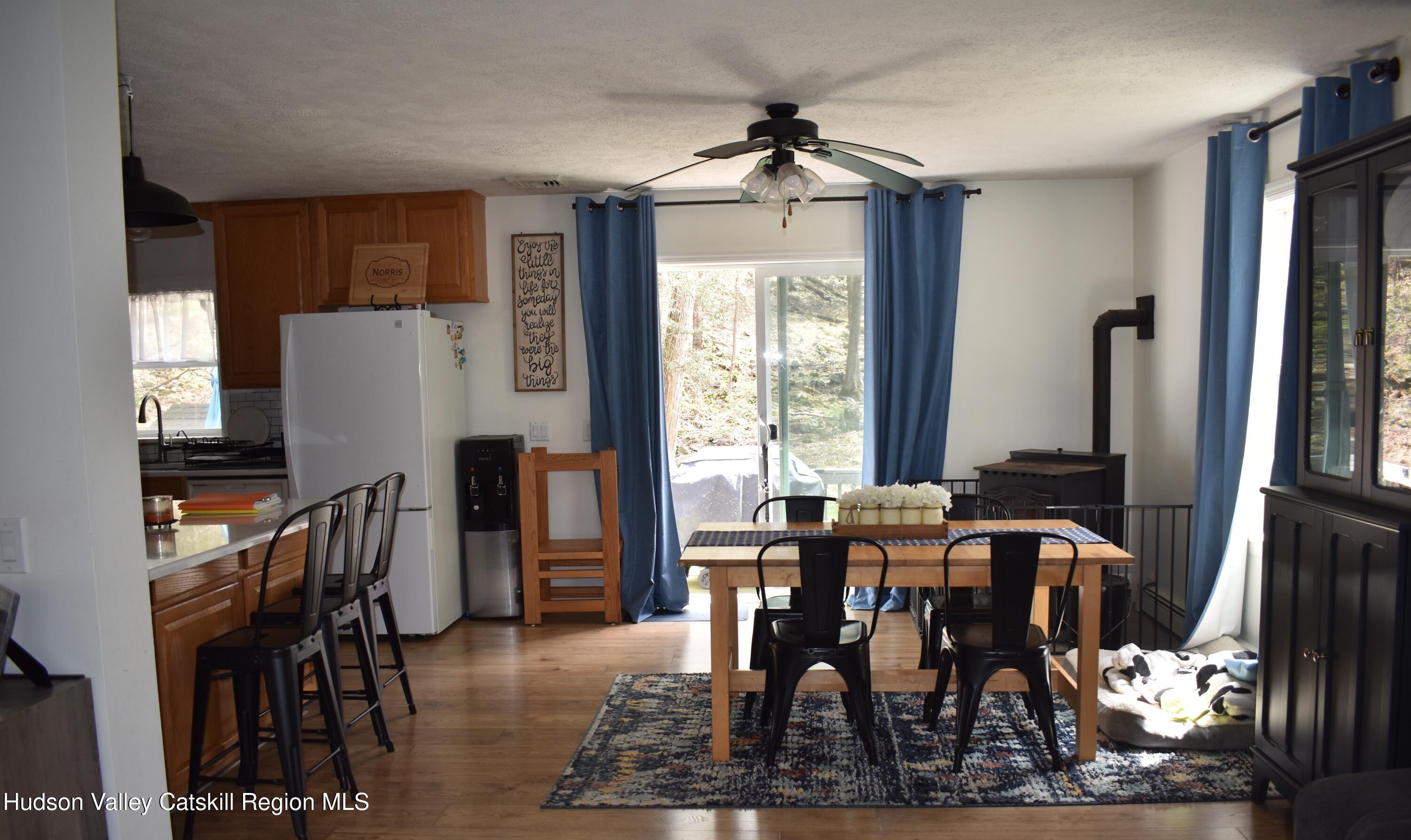 125 Hardenburgh Road Ulster Park, NY 12487 - Photo 10 of 45 a view of a a dining room with furniture window and wooden floor