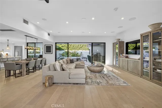 a living room with fireplace furniture and a flat screen tv
