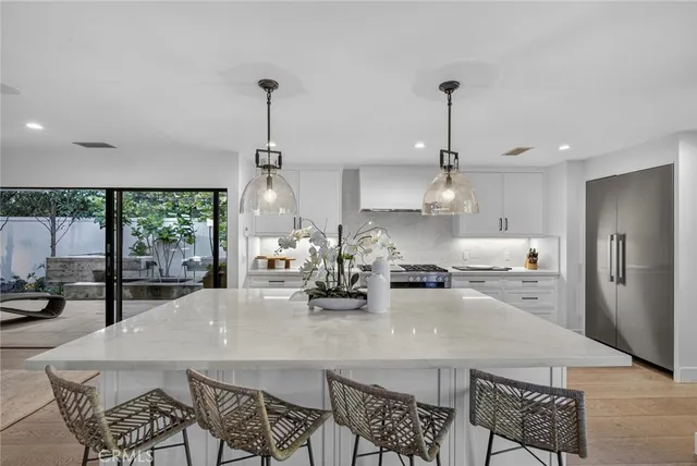 a view of swimming pool with outdoor seating and garden
