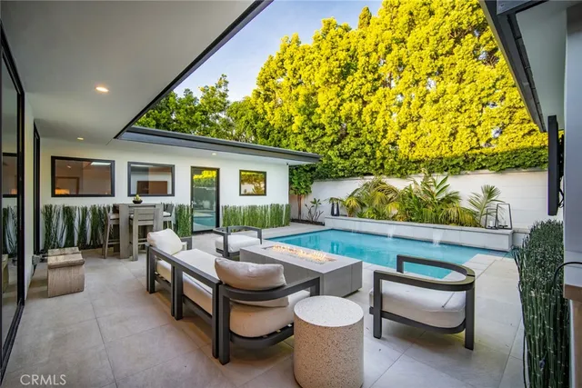 a outdoor space with patio couch and potted plants