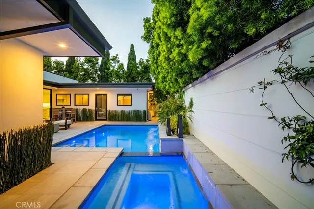a view of swimming pool with outdoor seating