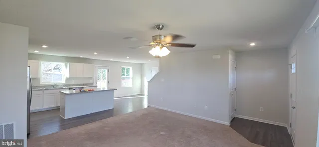 a kitchen with granite countertop cabinets a sink and stainless steel appliances