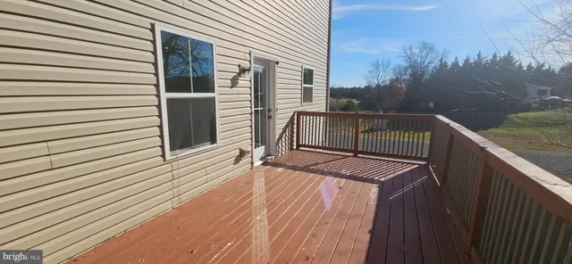 a balcony with view of trees in the background