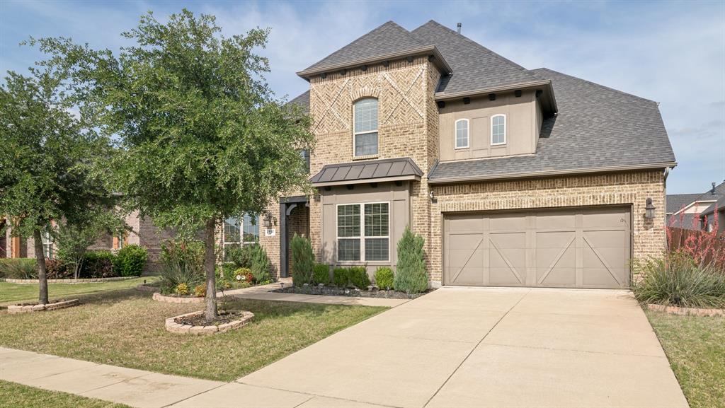 2802 Merlot Circle Rowlett, TX 75088 - Photo 2 of 40 a front view of a house with garden