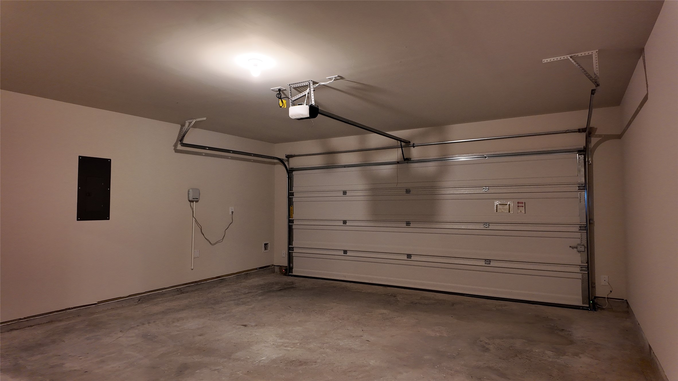 16241 Parish Pointe Court Conroe, TX 77302 - Photo 12 of 25 a view of a room with racks on the wall