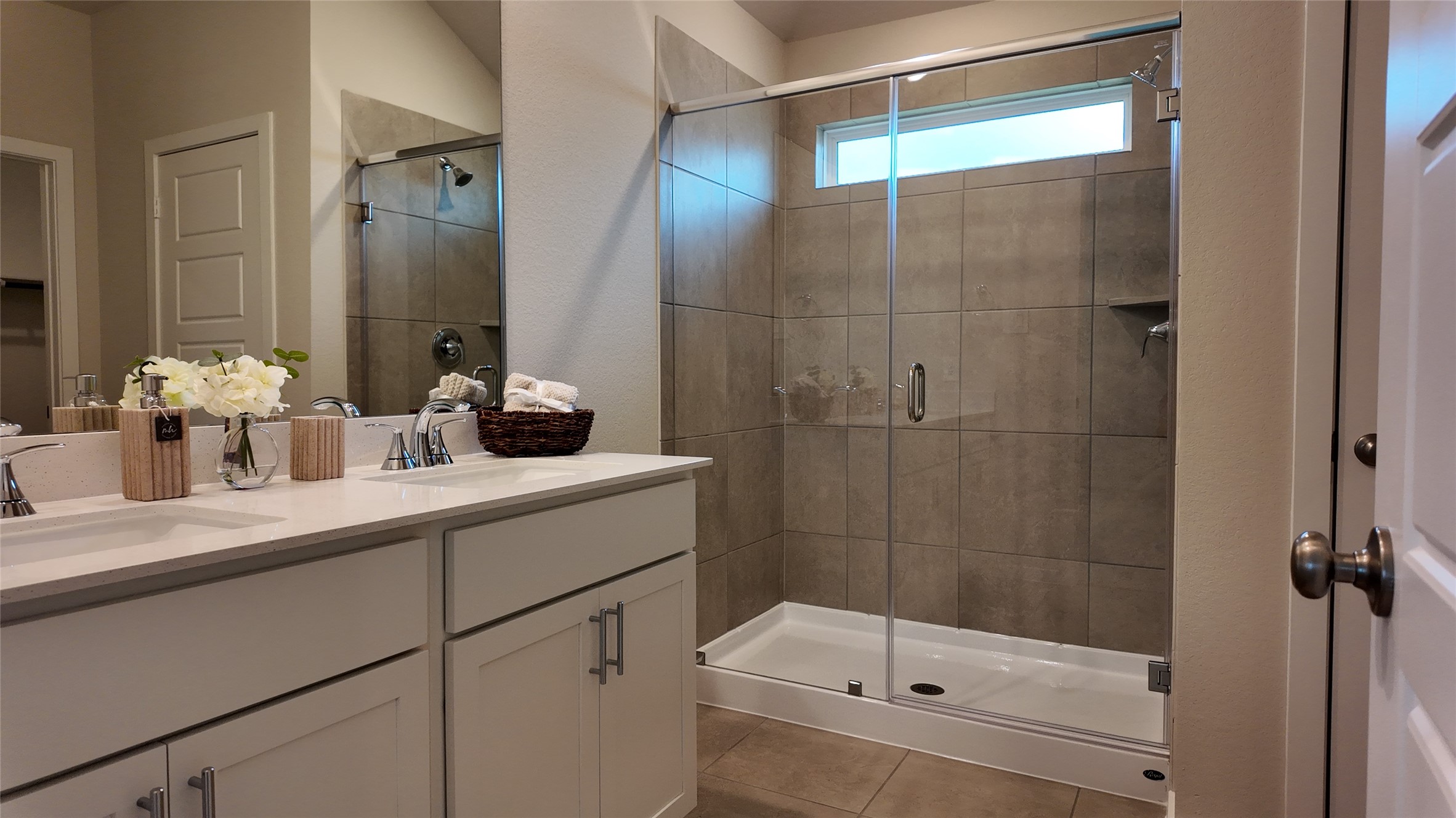 16241 Parish Pointe Court Conroe, TX 77302 - Photo 20 of 25 a bathroom with a shower sink and mirror