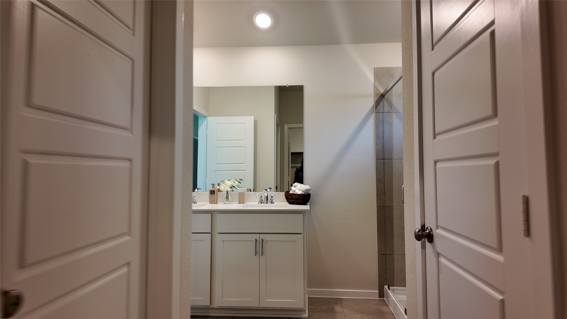 16241 Parish Pointe Court Conroe, TX 77302 - Photo 21 of 25 a bathroom with a sink and a mirror