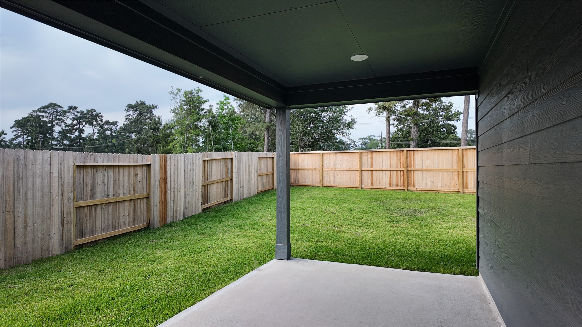 16241 Parish Pointe Court Conroe, TX 77302 - Photo 24 of 25 a view of a backyard with barn