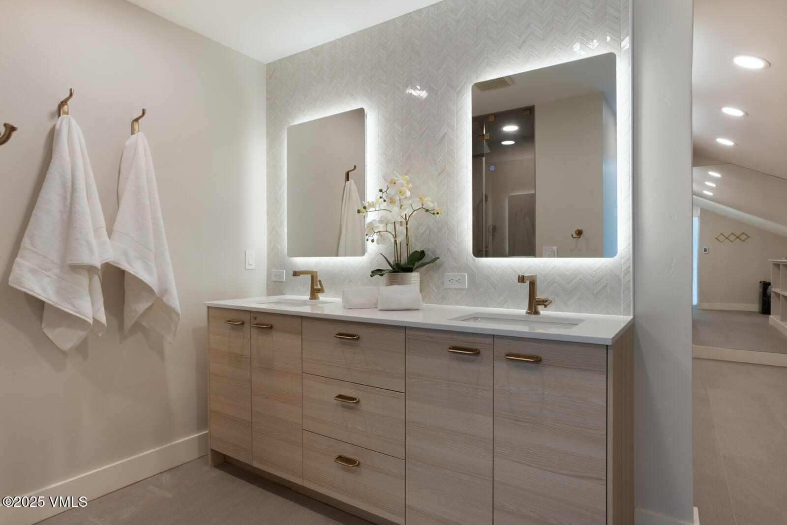 50 Hereford Road Edwards, CO 81632 - Photo 14 of 36 a bathroom with a double vanity sink and a mirror