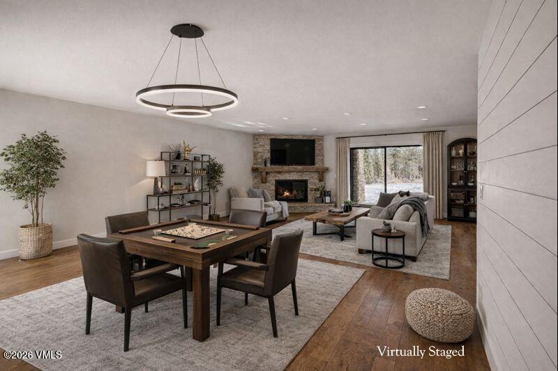 50 Hereford Road Edwards, CO 81632 - Photo 3 of 36 a dining room with furniture a rug and a chandelier
