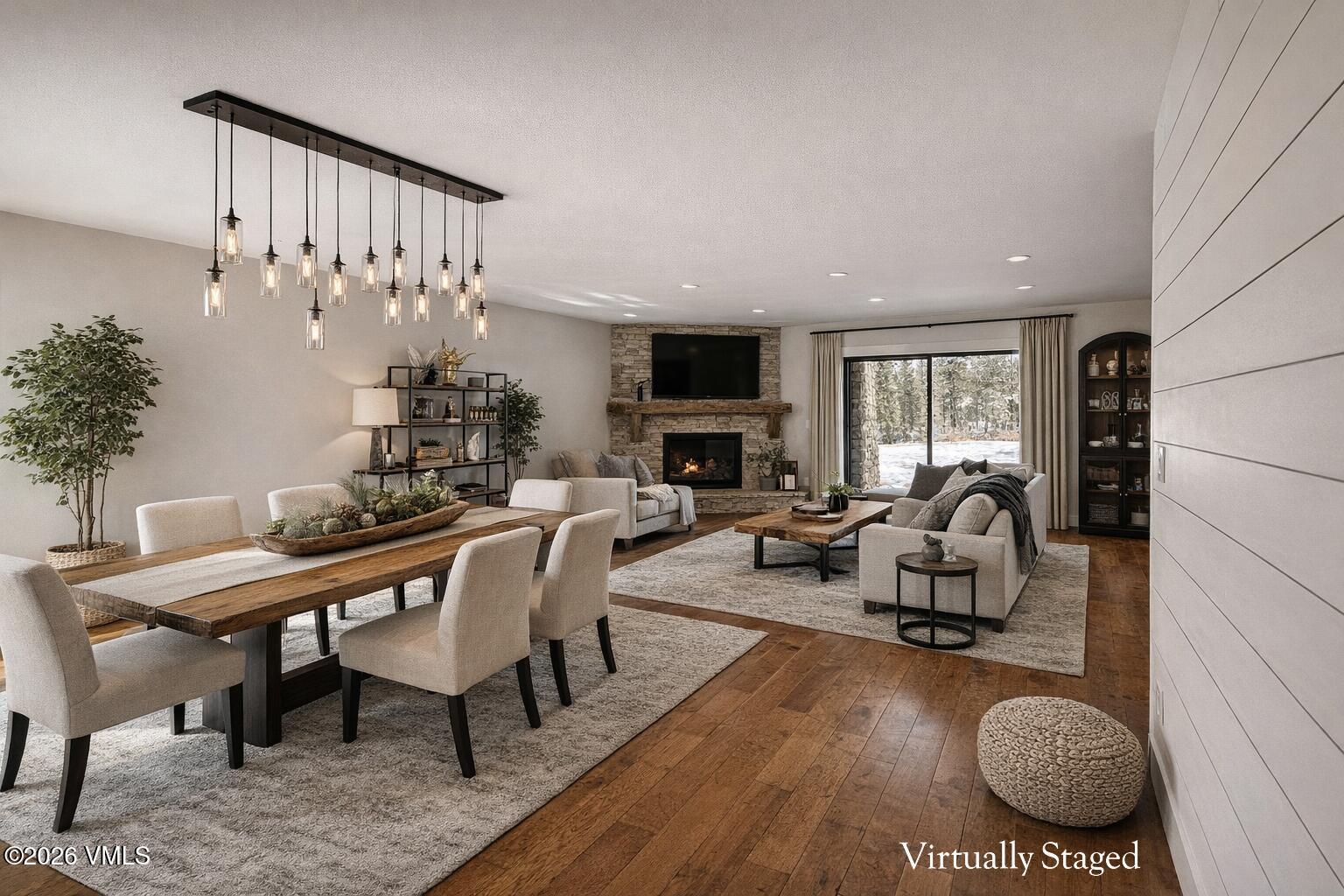 50 Hereford Road Edwards, CO 81632 - Photo 5 of 36 a living room with furniture a rug and a chandelier
