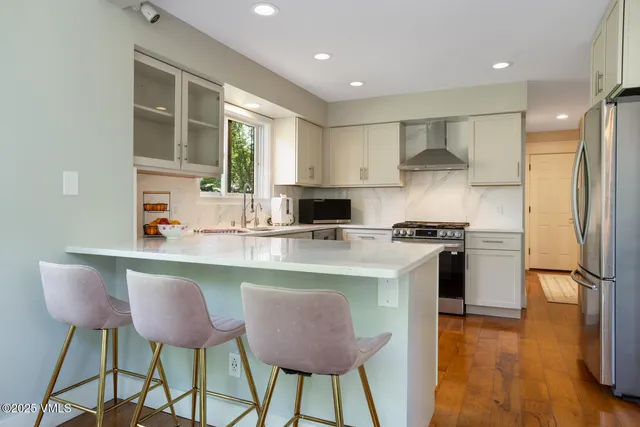 a kitchen with a sink window and cabinets