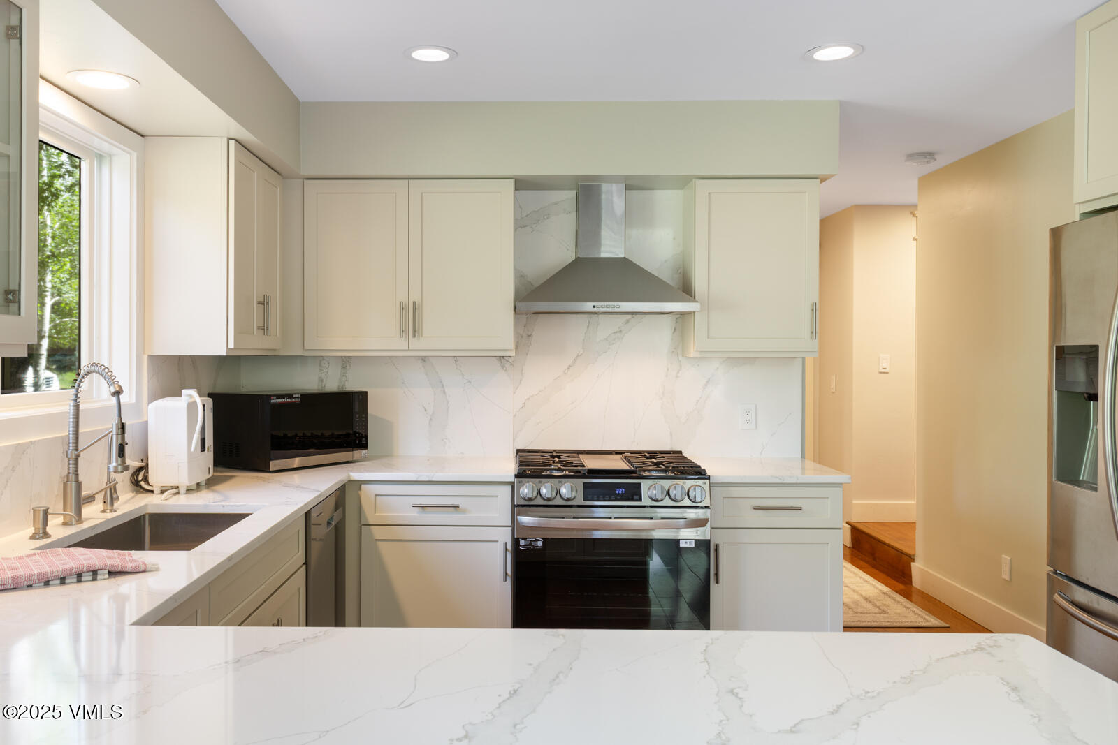 50 Hereford Road Edwards, CO 81632 - Photo 9 of 36 a kitchen with stainless steel appliances a stove a sink and a refrigerator