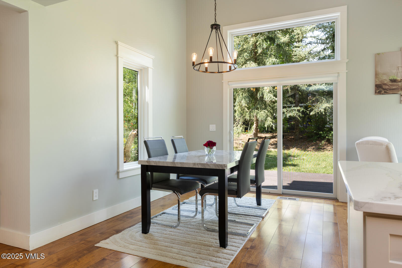 50 Hereford Road Edwards, CO 81632 - Photo 10 of 36 a view of a dining room with furniture window and wooden floor