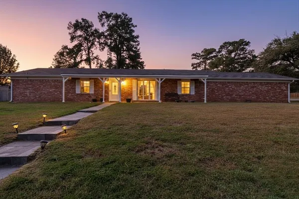 front view of a house with a yard