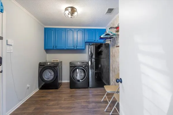 a view of a storage & utility room with washer and dryer