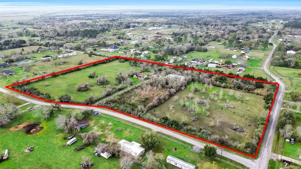 an aerial view of residential houses with outdoor space and garden