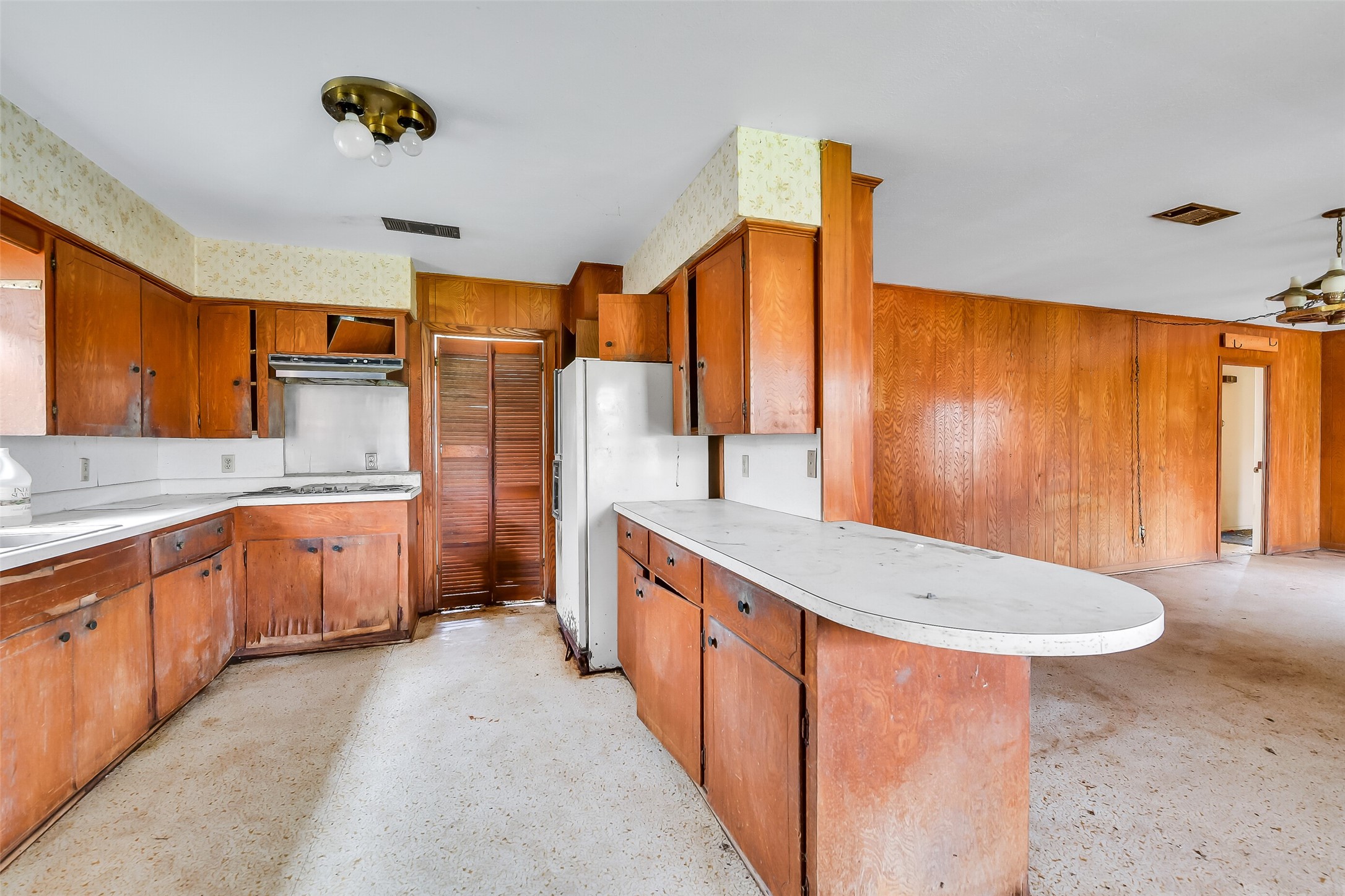 4918 Farmer Road Alvin, TX 77511 - Photo 14 of 18 a kitchen with stainless steel appliances a sink and a refrigerator
