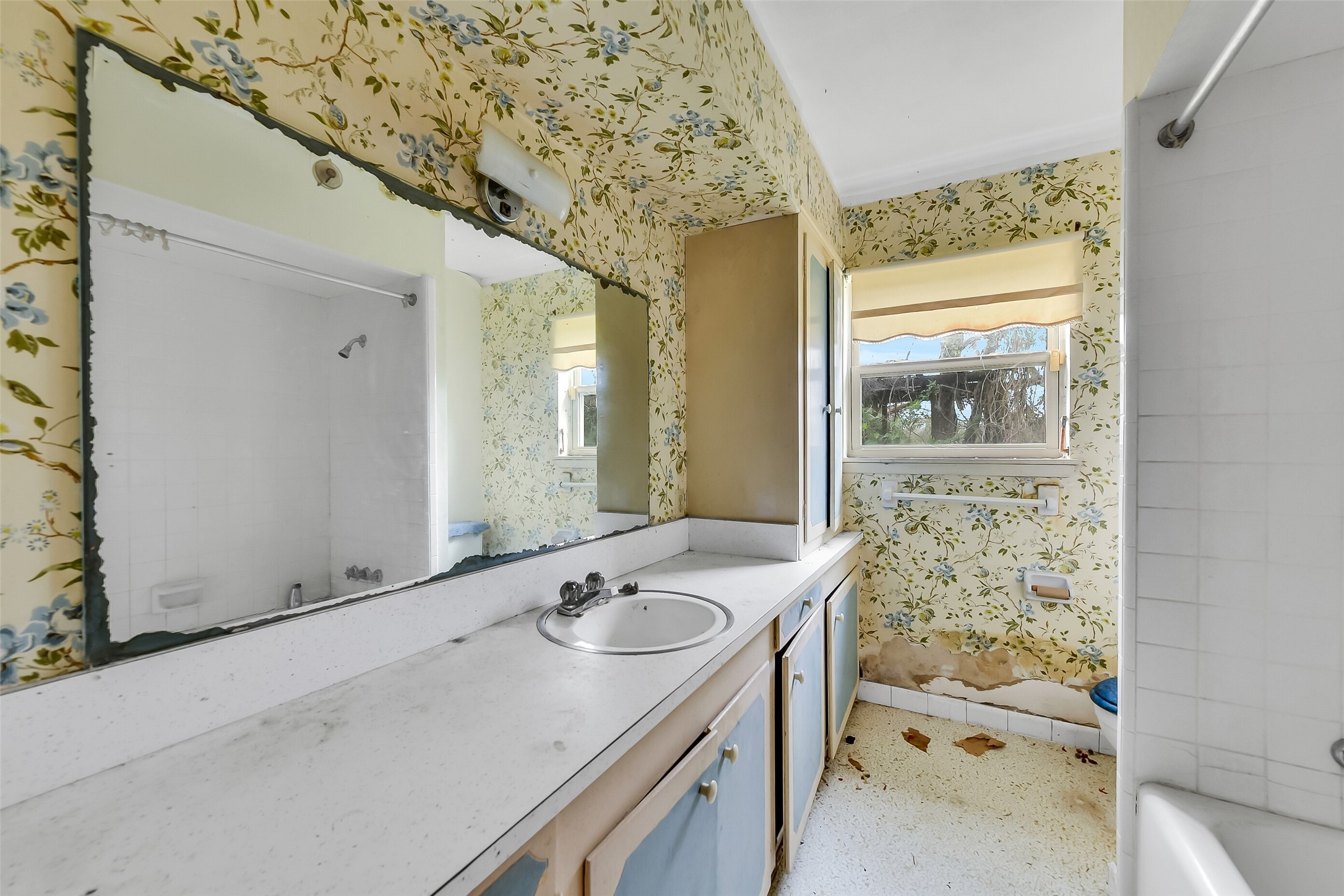 4918 Farmer Road Alvin, TX 77511 - Photo 16 of 18 a bathroom with a sink and a mirror