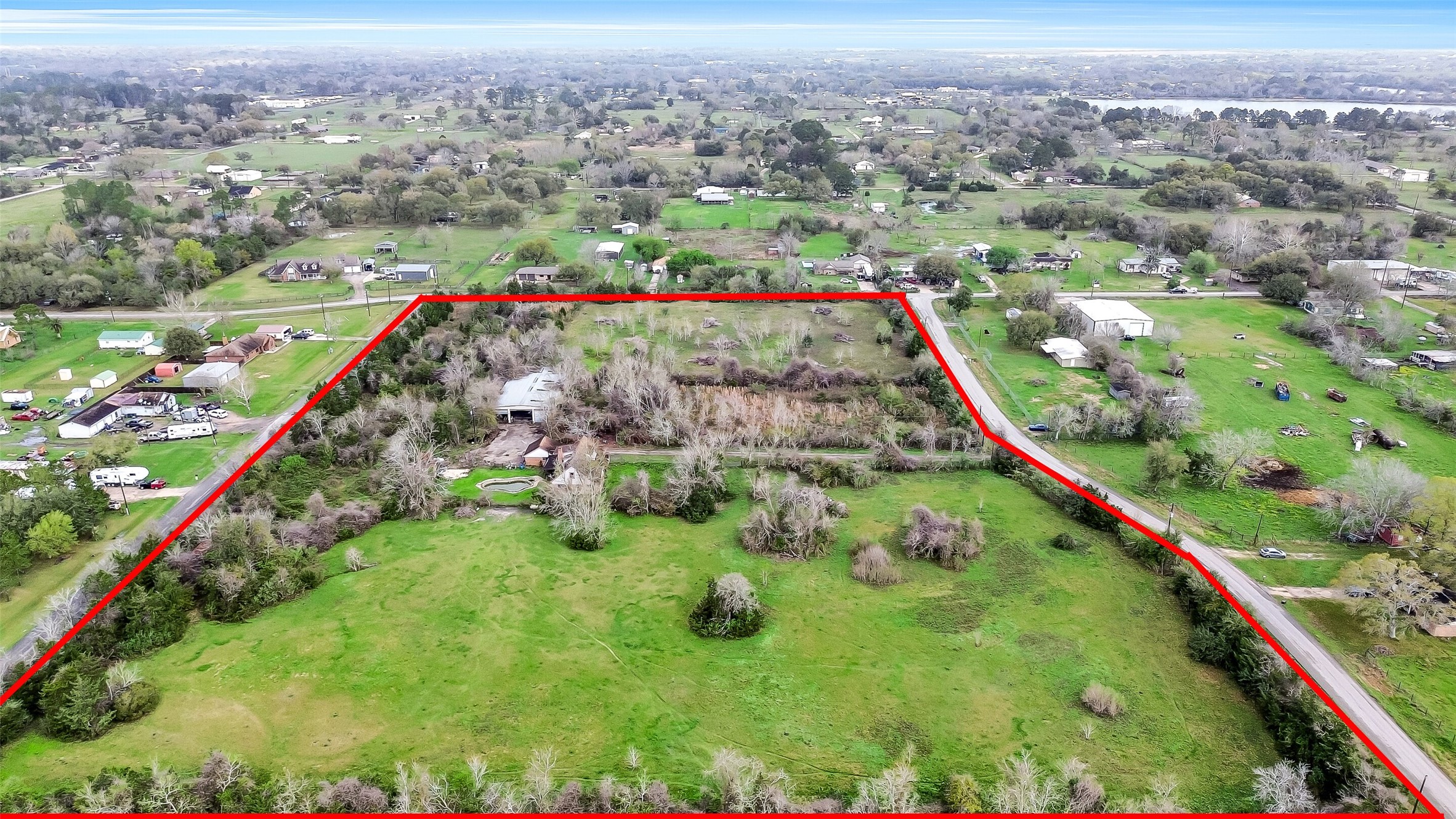 4918 Farmer Road Alvin, TX 77511 - Photo 2 of 18 an aerial view of residential houses with outdoor space and garden