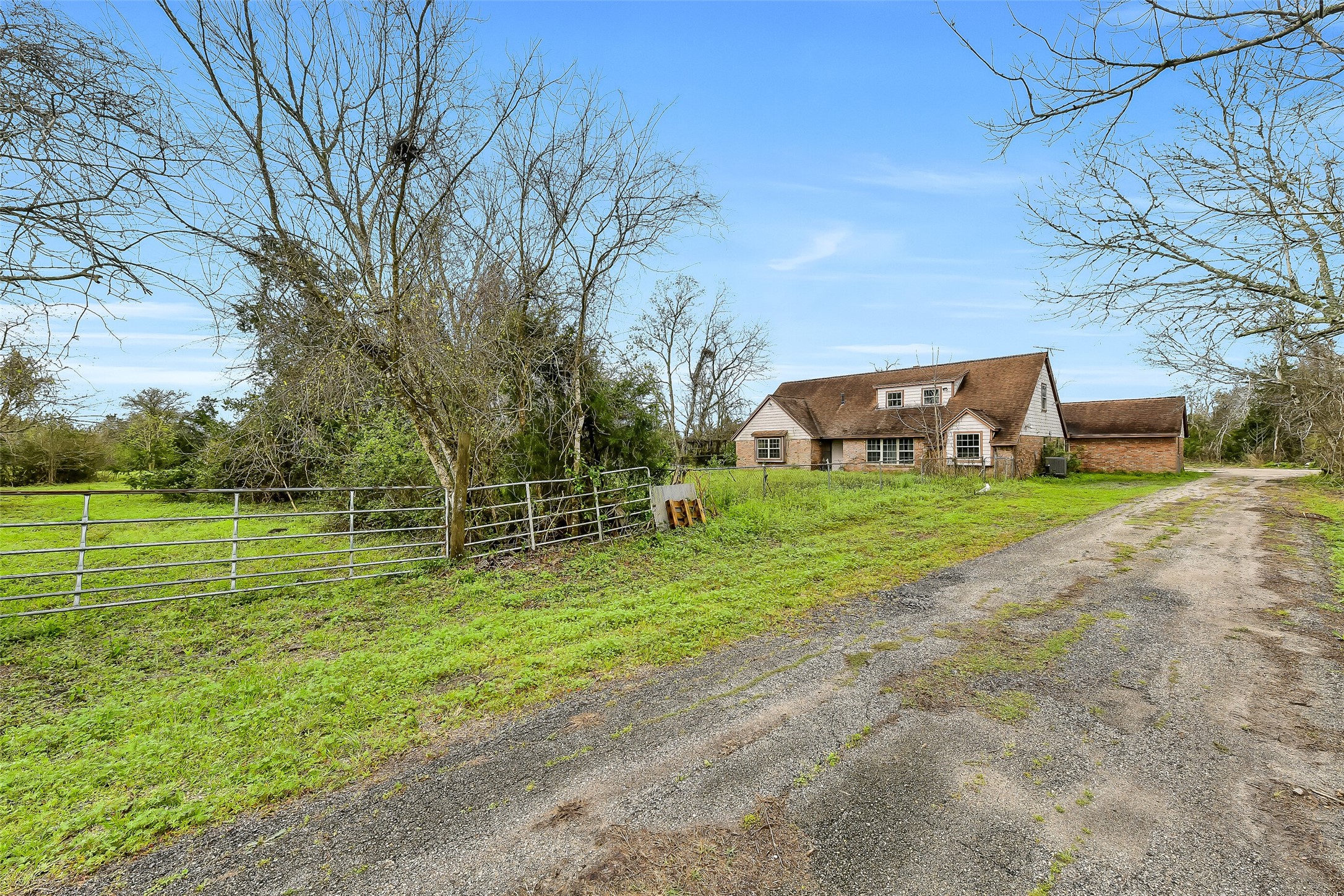 4918 Farmer Road Alvin, TX 77511 - Photo 10 of 18 a front view of a house with garden