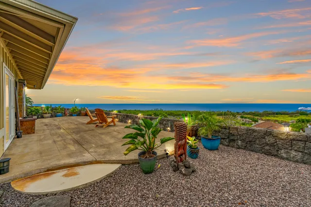 a view of a swimming pool with an outdoor seating