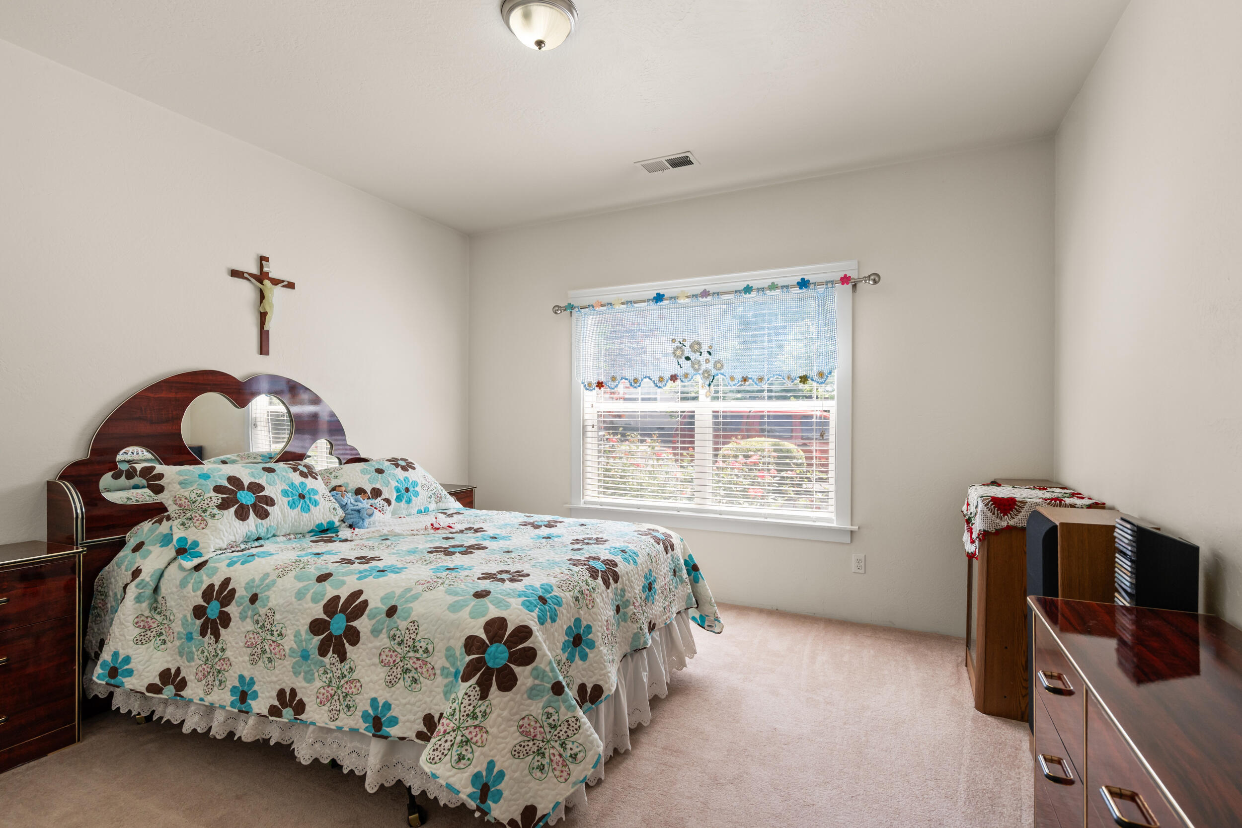 1227 Lithia Way Talent, OR 97540 - Photo 22 of 37 a bedroom with a bed and a window