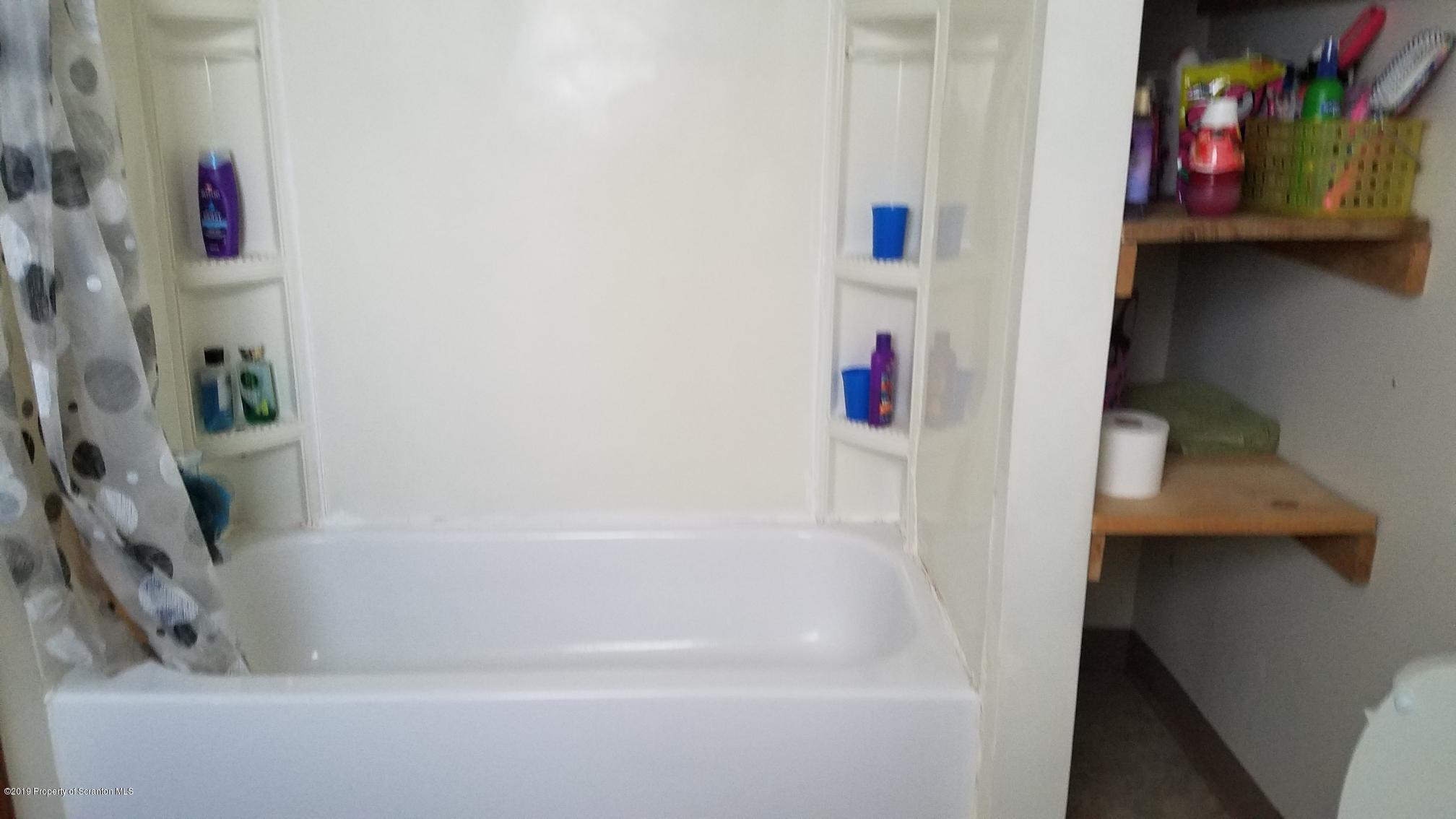 1763 Ridge Road Montrose, PA 18801 - Photo 11 of 26 a bathroom with a bathtub and a shower