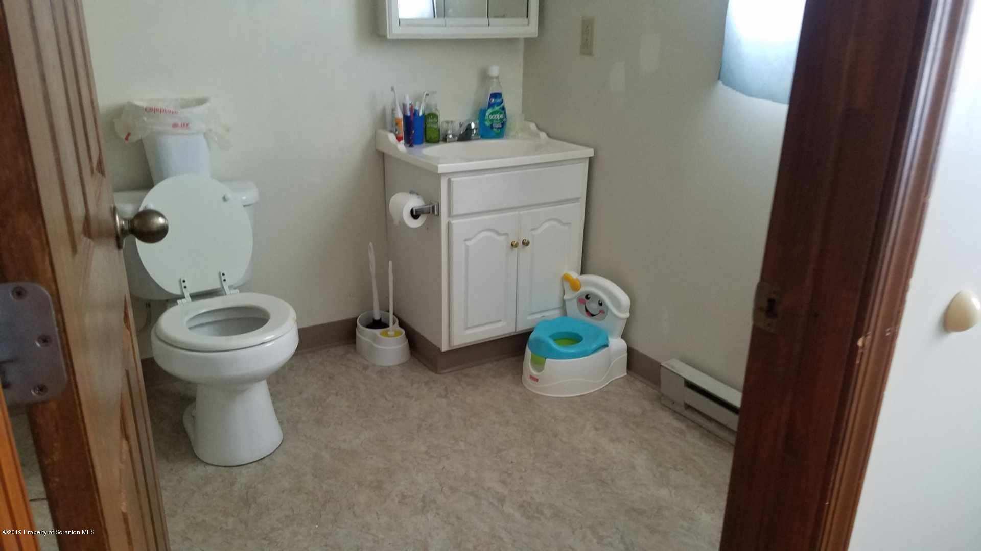 1763 Ridge Road Montrose, PA 18801 - Photo 12 of 26 a bathroom with a toilet and a sink