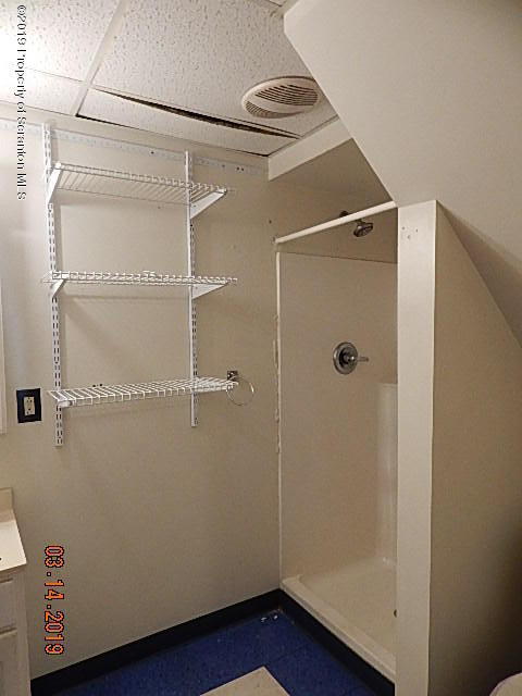 1763 Ridge Road Montrose, PA 18801 - Photo 19 of 26 a bathroom with a glass shower door