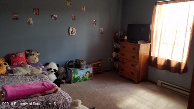 1763 Ridge Road Montrose, PA 18801 - Photo 9 of 26 a room with toys and a wooden floor