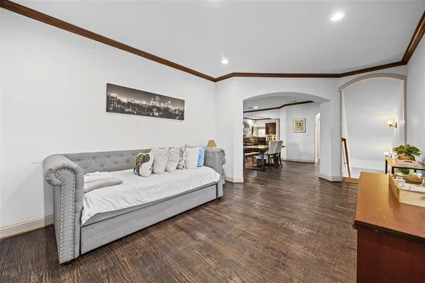 a kitchen with stainless steel appliances kitchen island granite countertop a refrigerator and a stove top oven
