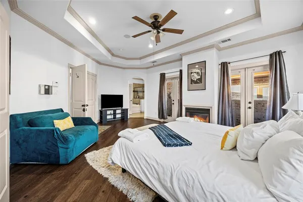 a living room with patio furniture and a floor to ceiling window