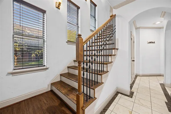 a view of entryway with wooden floor and stairs
