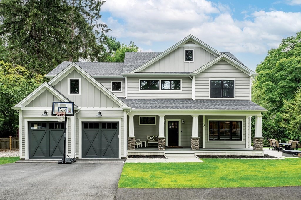 46 Tamworth Road Newton, MA 02468 - Photo 1 of 12 a front view of a house with a yard and porch