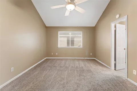 a spacious bathroom with a granite countertop sink mirror and a shower