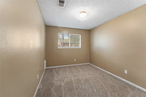 a view of a patio with wooden floor