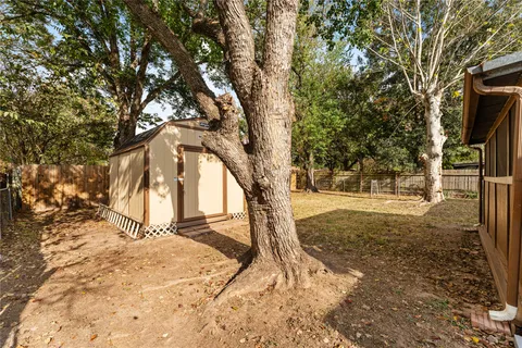a house with trees in front of it