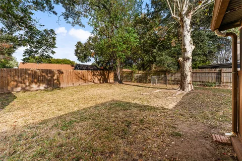 a house that has a tree in front of it