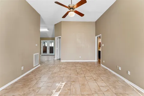 a view of a hallway with a chandelier