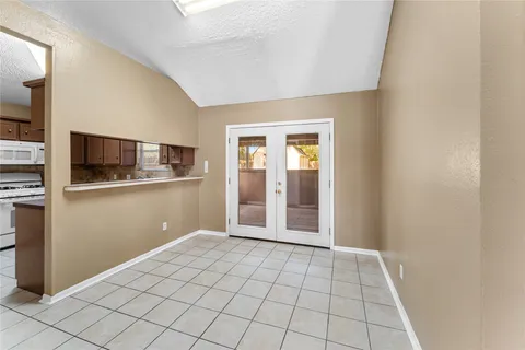 a view of a kitchen from the hallway