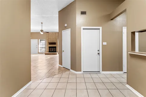 a view of a electric appliances and windows in a kitchen