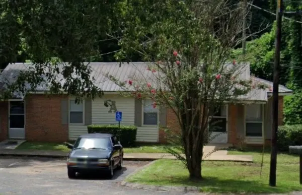 a car parked in front of a house