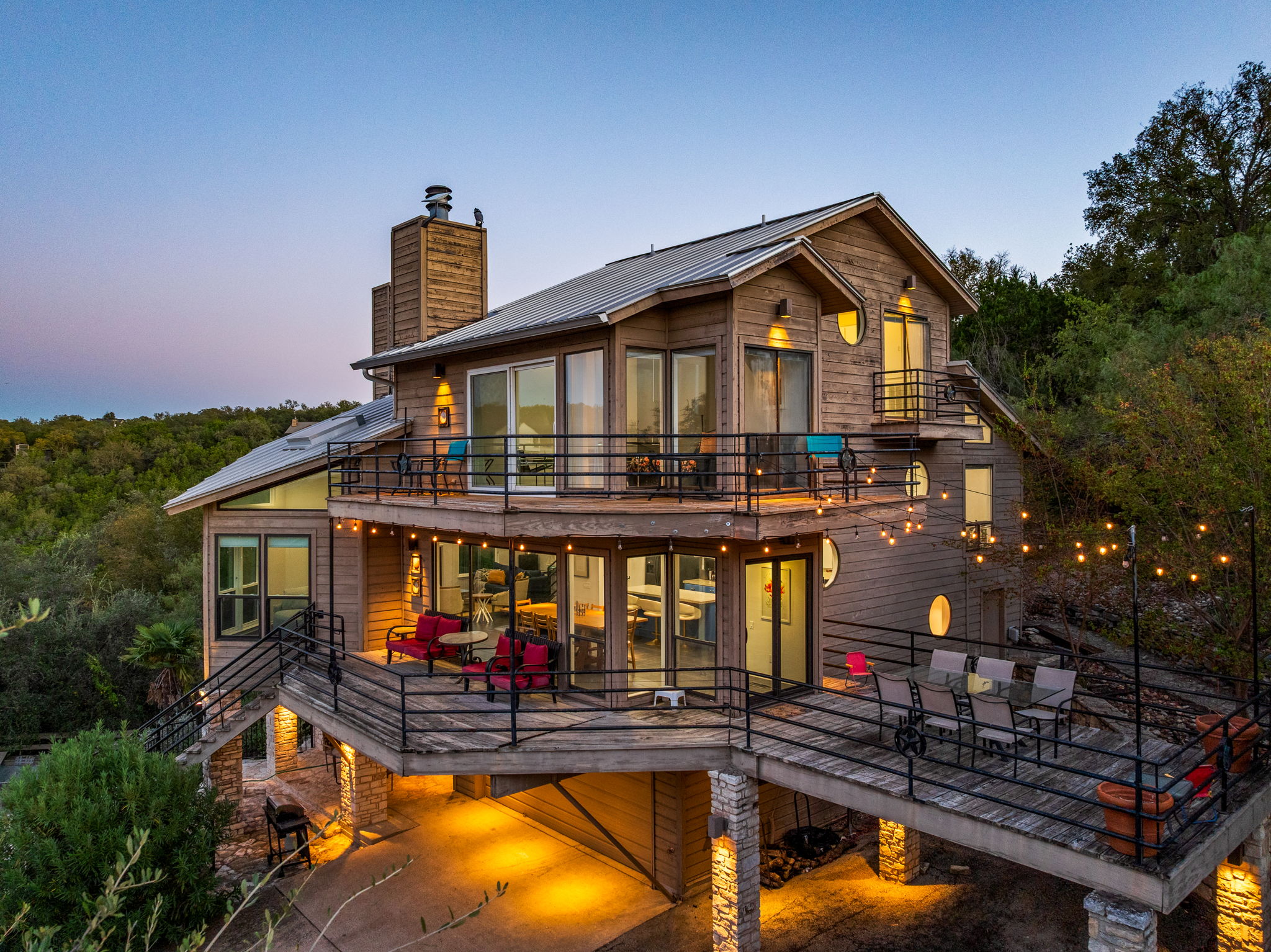 a view of a house with swimming pool and sitting area