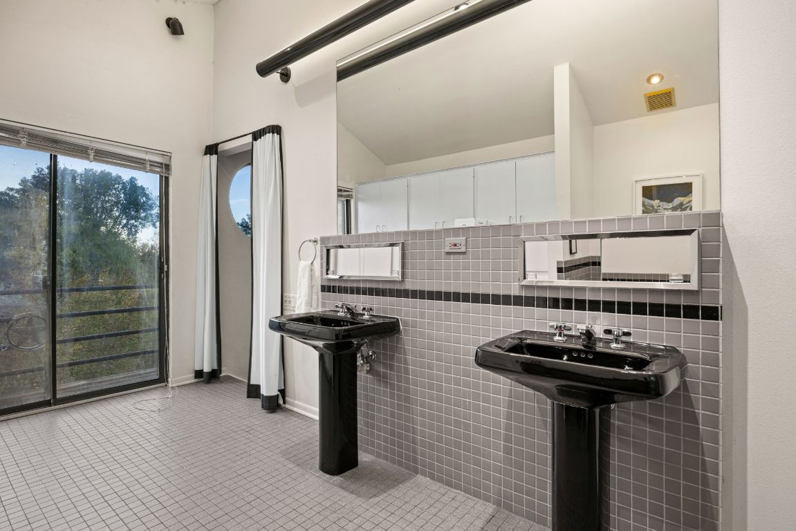 723 Coventry Road Spicewood, TX 78669 - Photo 17 of 40 a kitchen with stainless steel appliances a stove a refrigerator and a cabinets