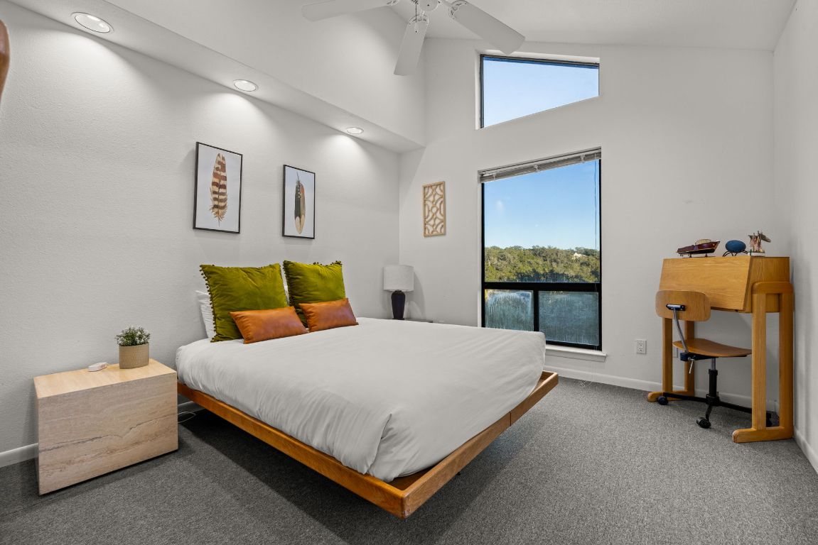 723 Coventry Road Spicewood, TX 78669 - Photo 19 of 40 a bedroom with a bed and a window