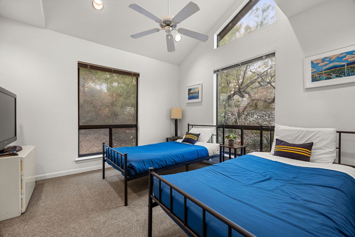 723 Coventry Road Spicewood, TX 78669 - Photo 20 of 40 a room with furniture and paintings on the wall