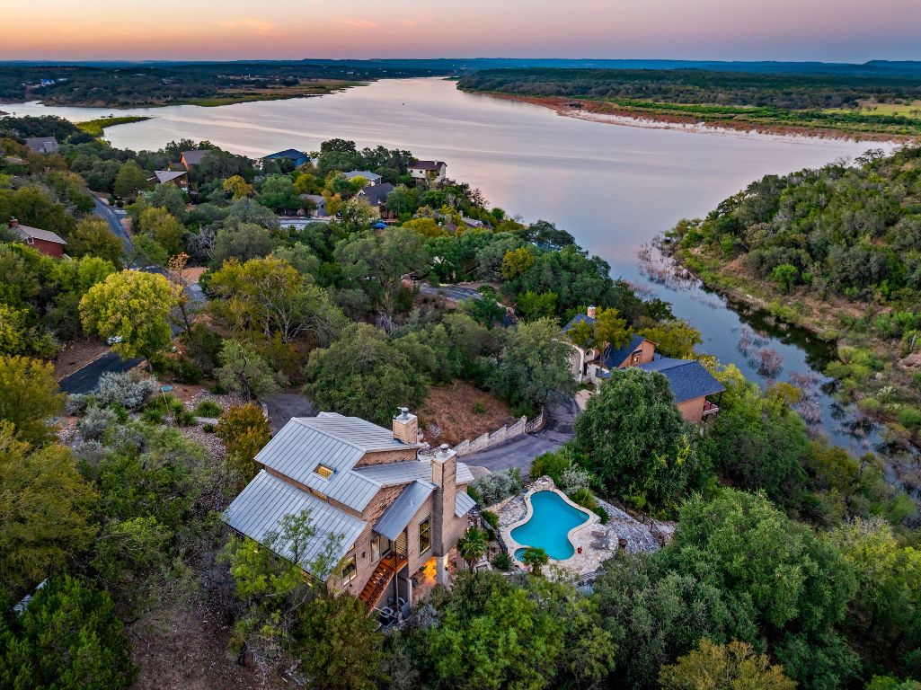 723 Coventry Road Spicewood, TX 78669 - Photo 2 of 40 an aerial view of a city with lots of residential buildings ocean and mountain view