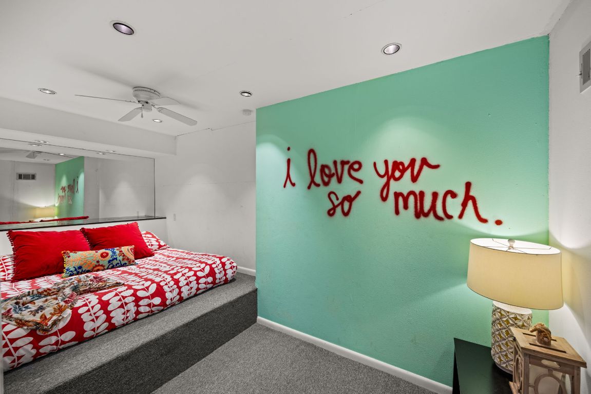 723 Coventry Road Spicewood, TX 78669 - Photo 24 of 40 a bedroom with a bed and a dresser